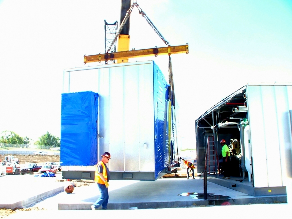 Systecon system being lifted on crane for installation and workers assisting