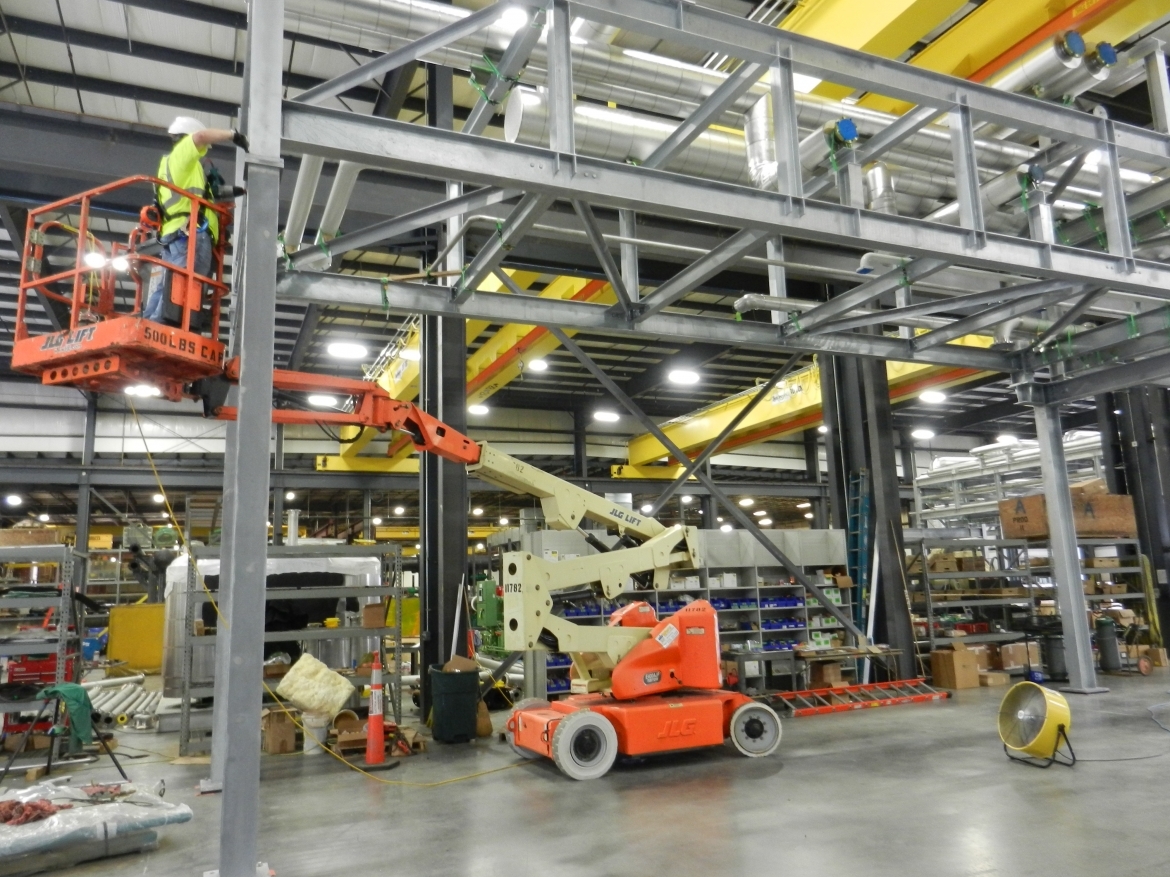 Man on lift in Systecon factory
